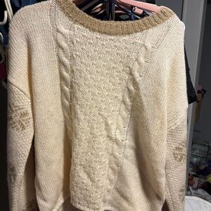 Cozy cream and tan knit sweater with snowflakes